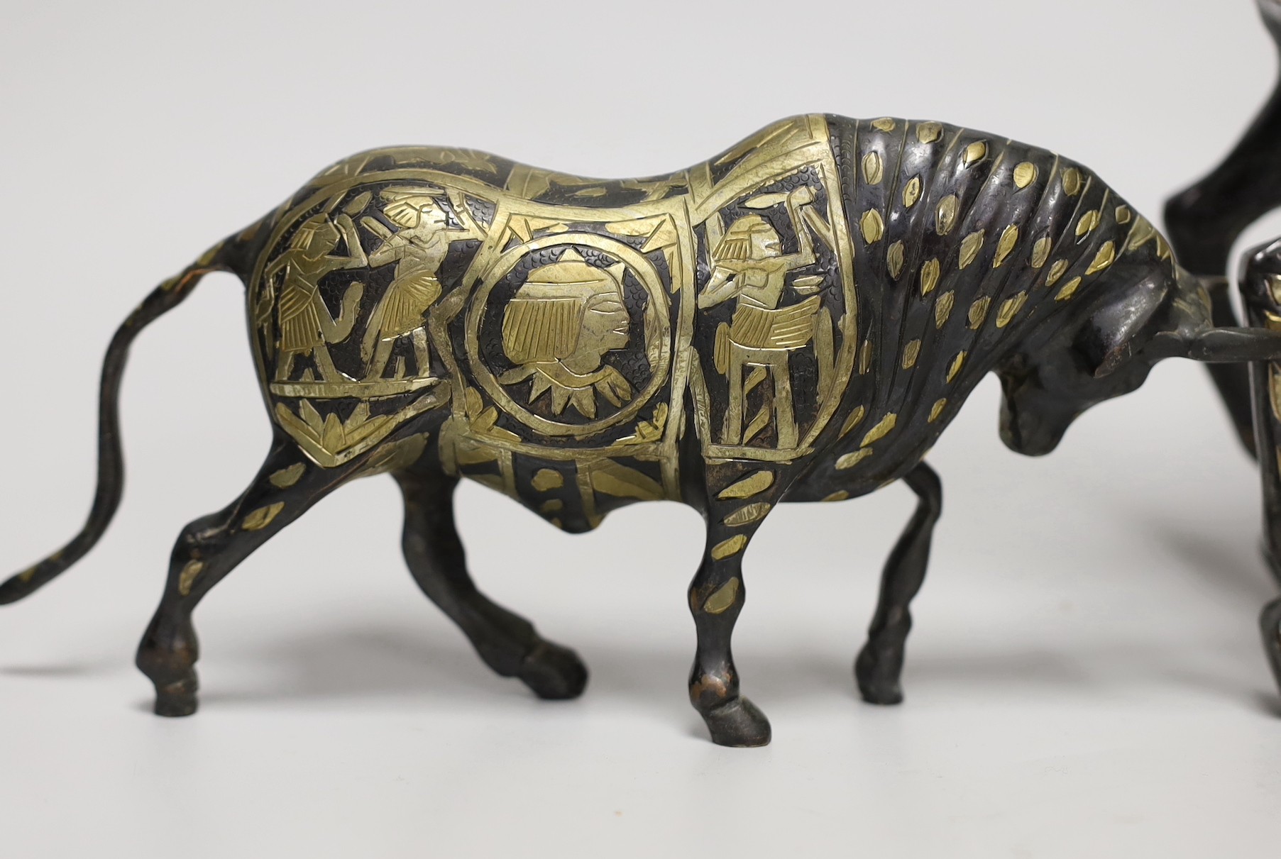 Two Egyptian cast brass and mixed metal models of a bull and a horse. Tallest 23cm